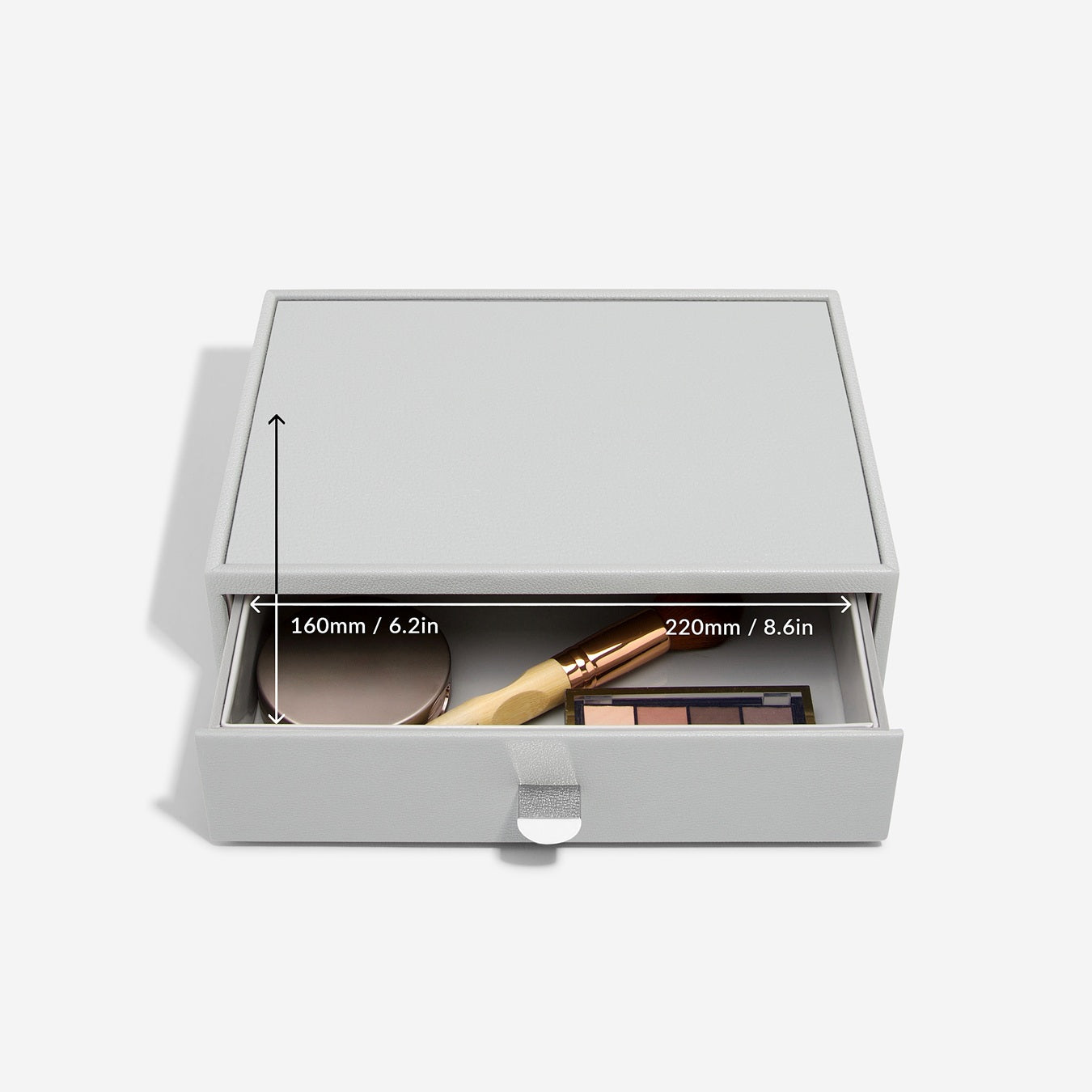 Pebble grey makeup storage drawer with open drawer showing cosmetic items on a white background with item measurements