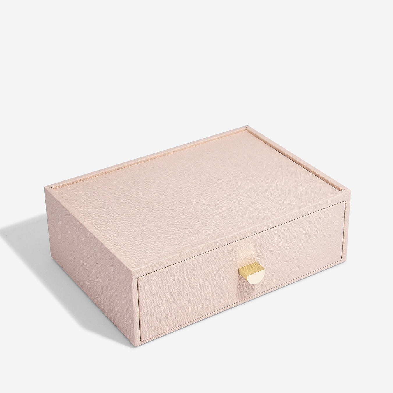 Pink jewelry box with a gold handle on a white background
