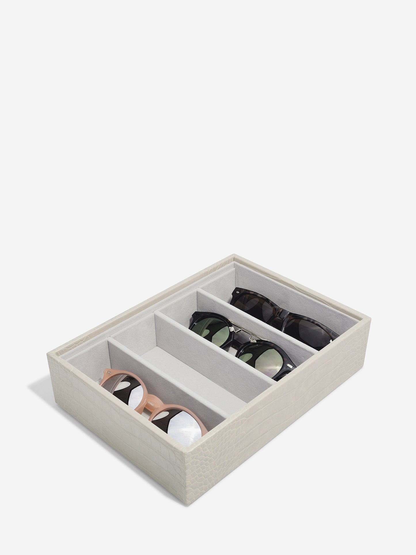 putty croc storage tray with four compartments. three compartments have sunglasses in them.
