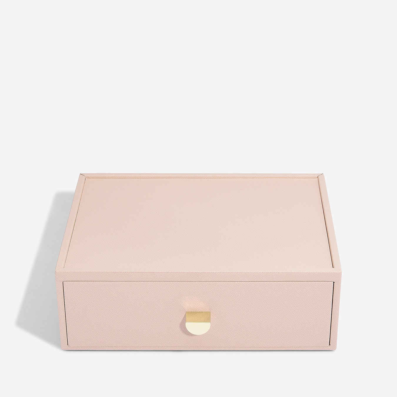 Pink jewelry box with a gold clasp on a white background