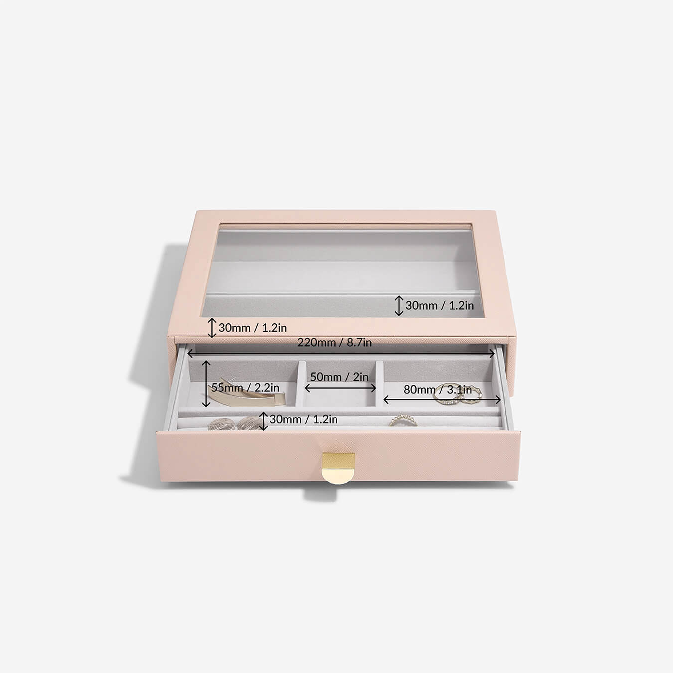 Pink jewelry box with clear lid displaying dimensions on a white background