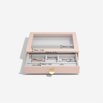 Pink jewelry box with clear lid displaying dimensions on a white background