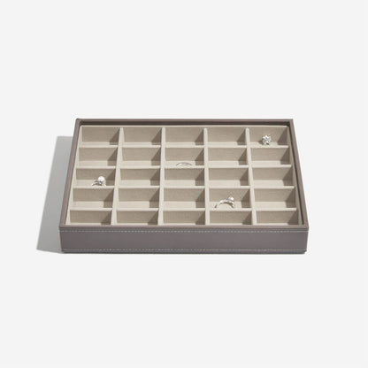 Mink coloured jewelry box with 25 compartments on a light gray background