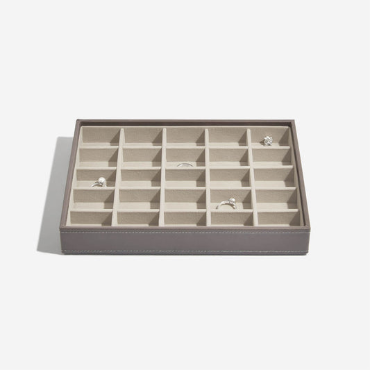 Mink coloured jewelry box with 25 compartments on a light gray background