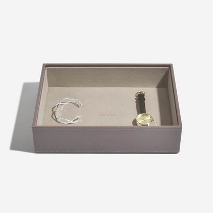 Jewelry set with a ring and bracelet in a mink jewelry box on a white background