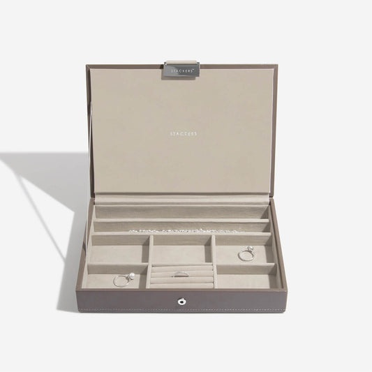 Open jewelry box with compartments on a white background