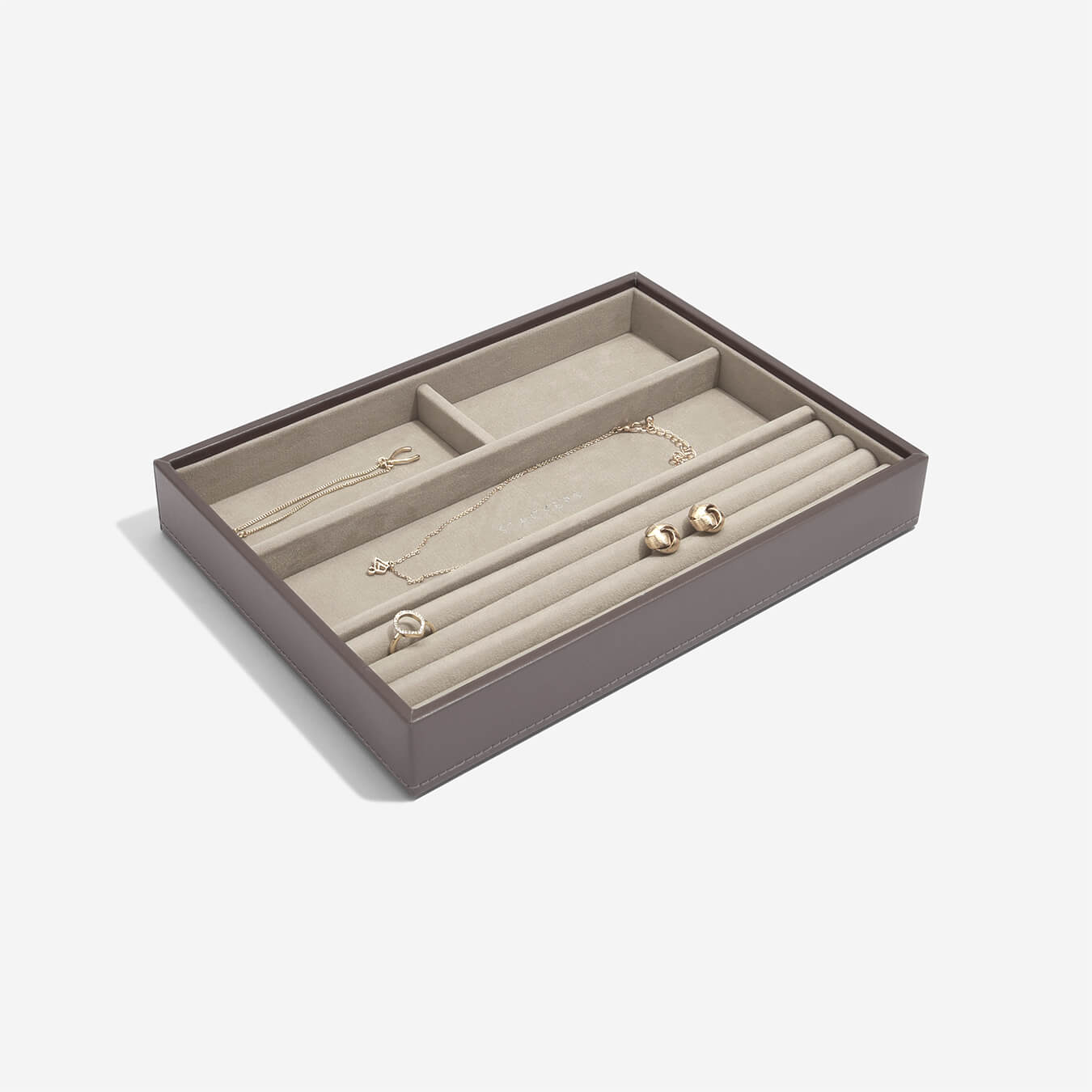 mink coloured jewellery tray with earrings and a necklace displayed inside