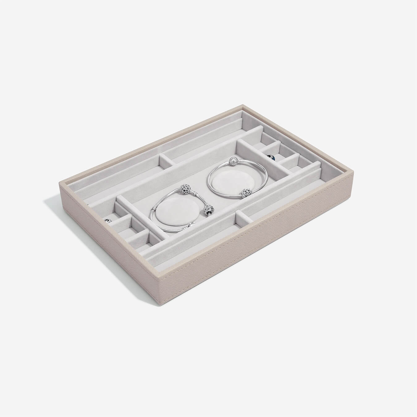 Taupe jewelry tray with compartments on a white background